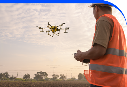 Drone capturing mapping data over infrastructure site